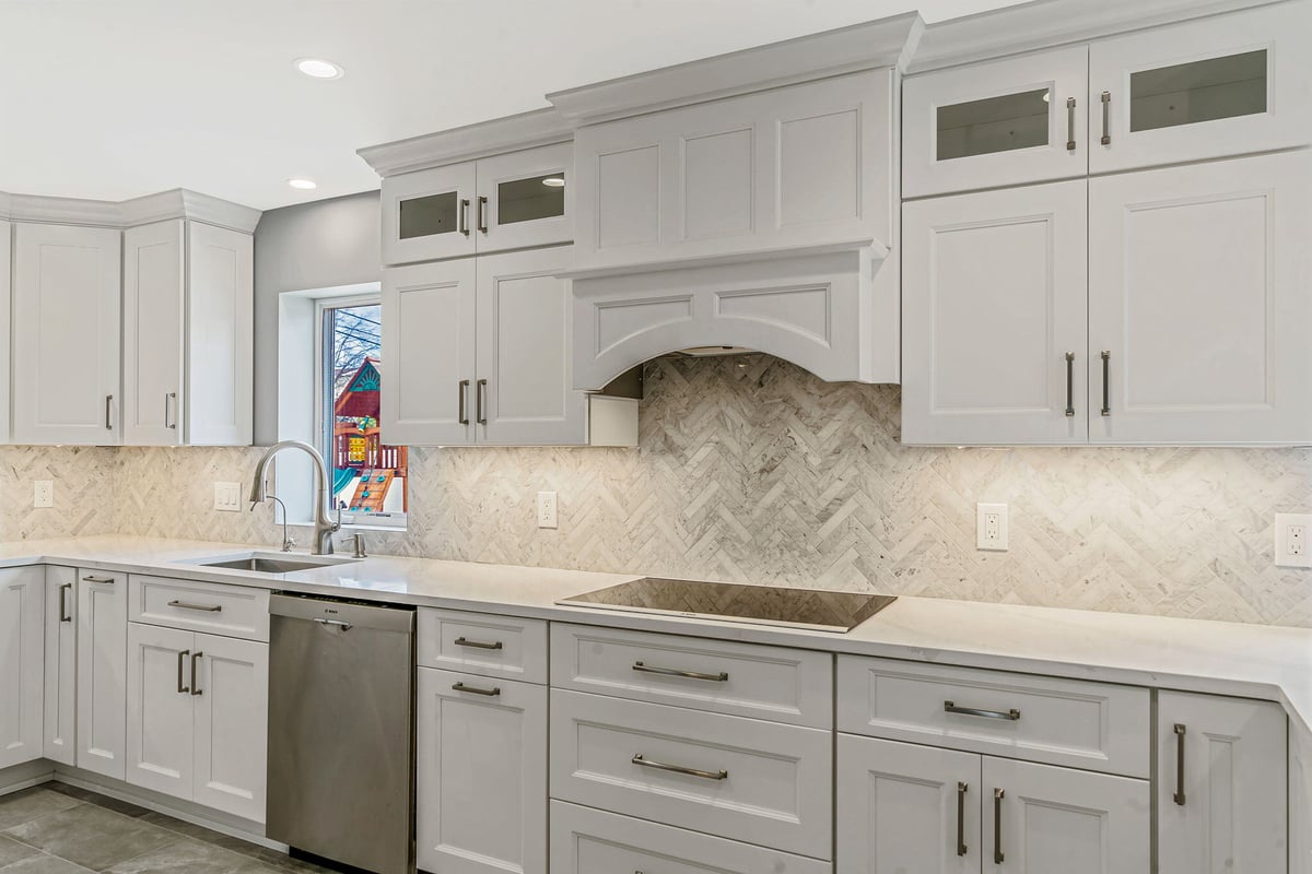 Kitchen remodel by Kuhn Construction with Fabuwood cabinets and mosaic backsplash