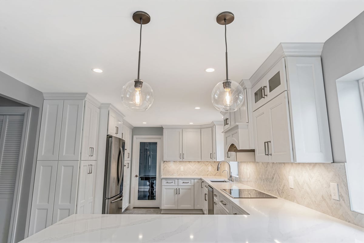 Round pendant lights in Massapequa, NY kitchen remodel by Kuhn Construction