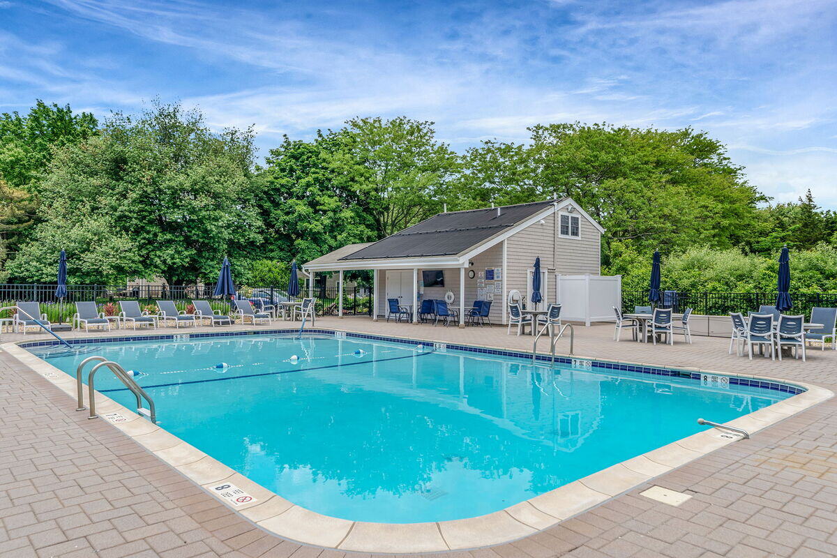 View of pool and poolhouse remodel in Islip, New York by Kuhn Construction