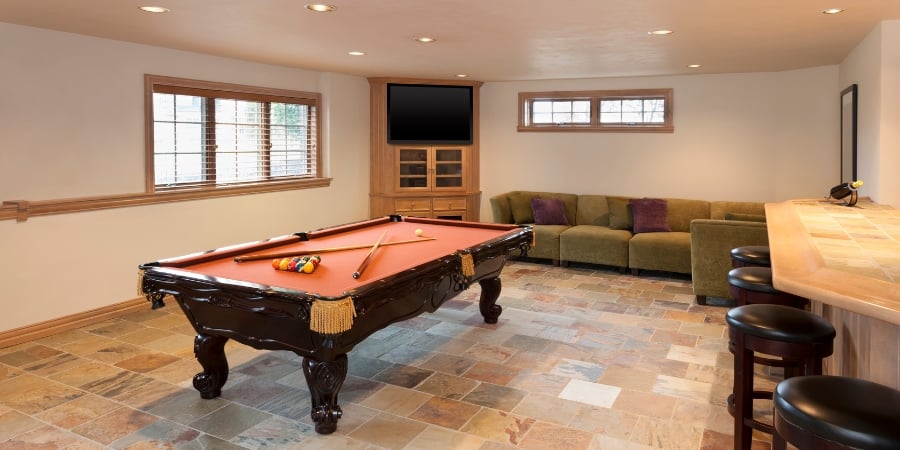 Finished basement in Islip, NY by Kuhn Construction with pool table and bar