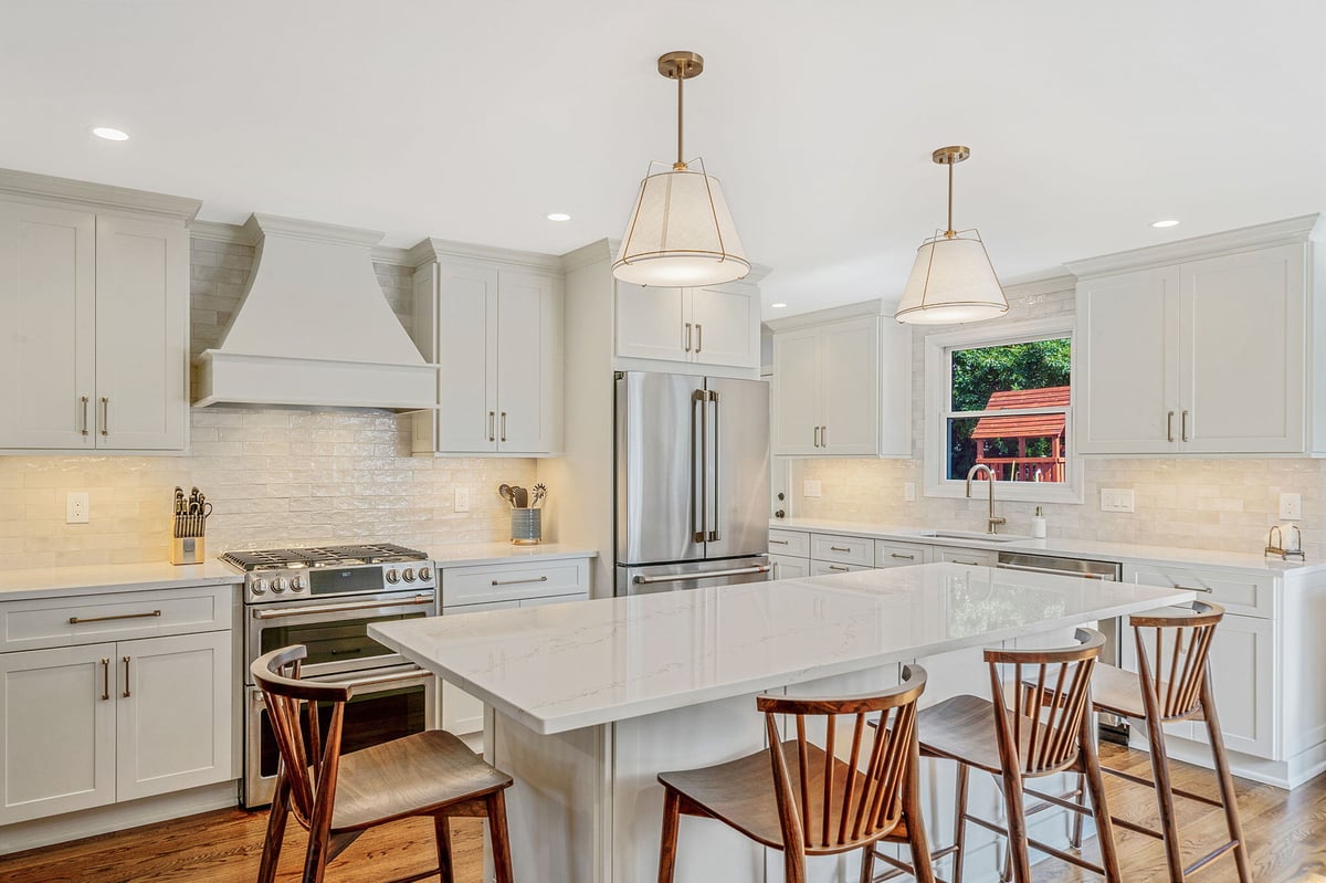 Custom kitchen remodel featuring an island, Fabuwood cabinetry, and oak floors in Hicksville, NY by Kuhn Construction