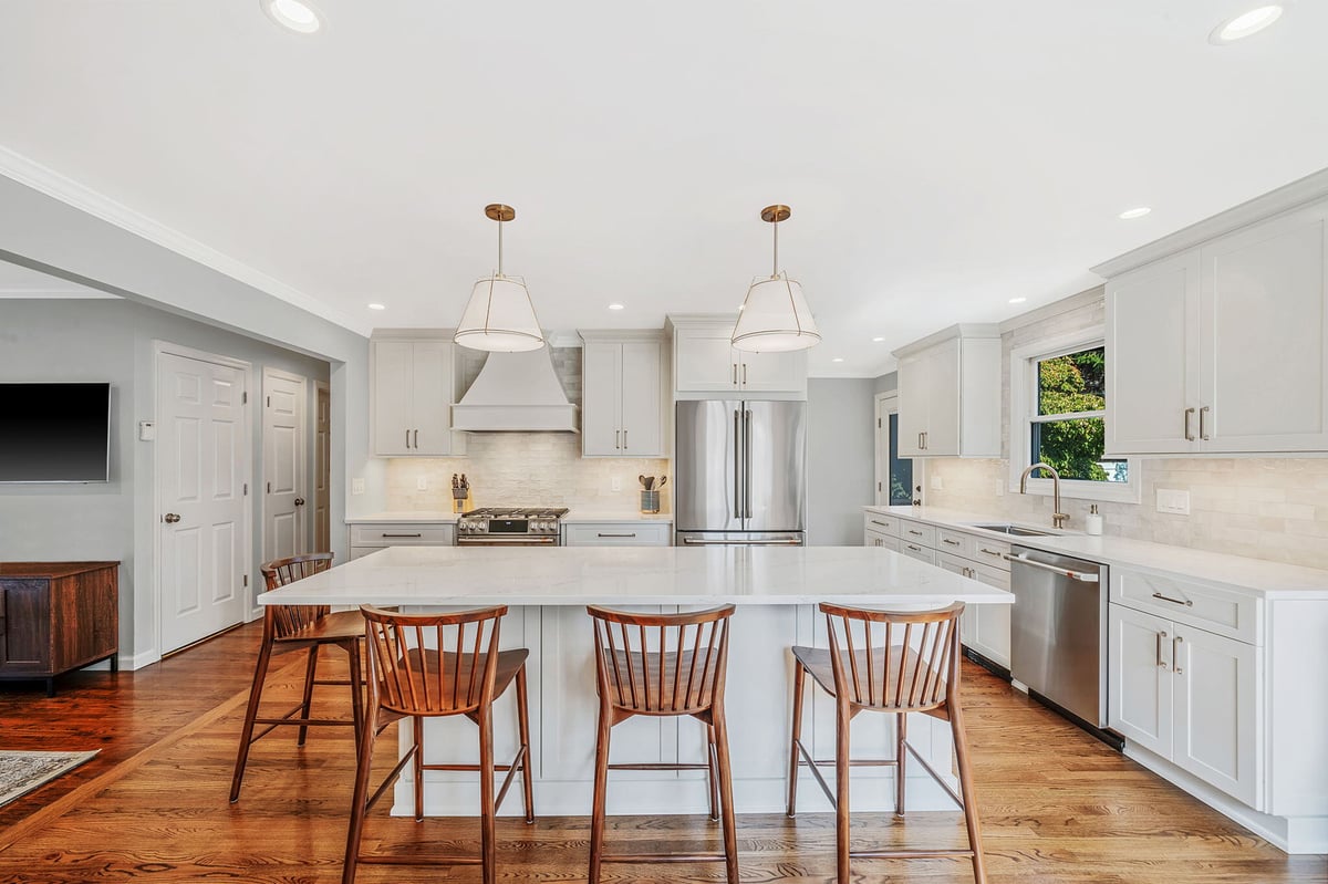 Open-concept kitchen remodel with large island and seating by Kuhn Construction in Hicksville, NY