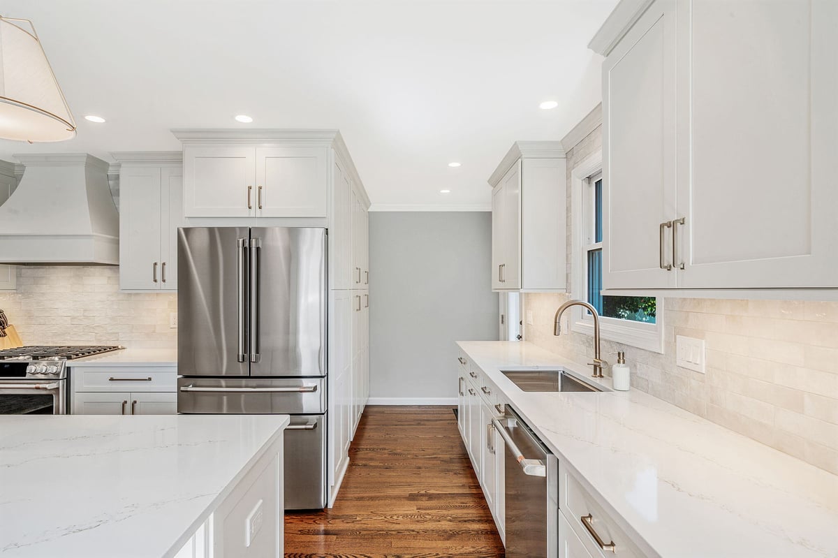 Open-concept kitchen renovation Fabuwood cabinets and stainless steel appliances in Hicksville, NY by Kuhn Construction