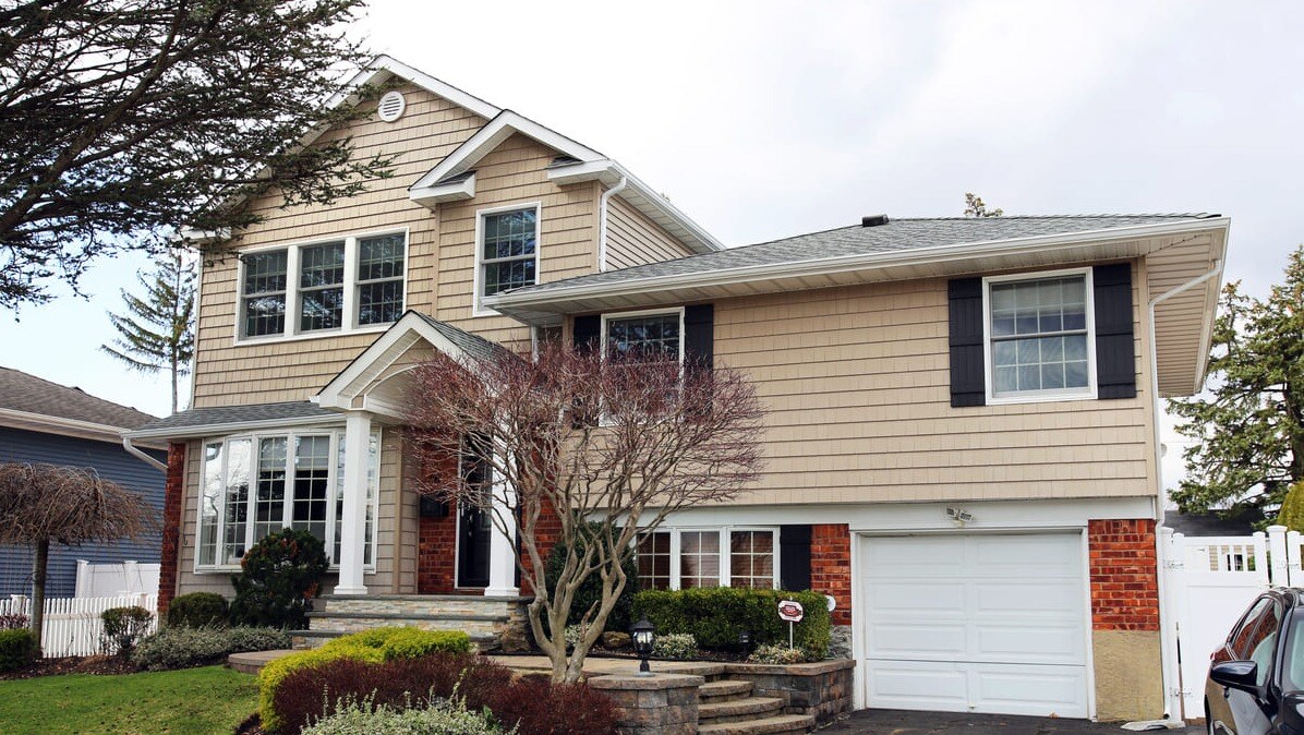 Islip, NY home addition exterior on second story by Kuhn Construction