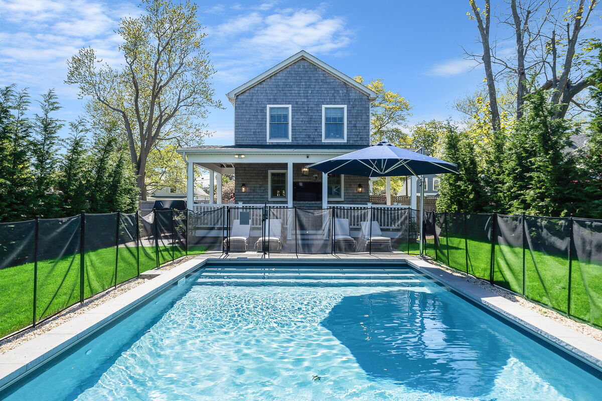 Pool and back porch of Greenport, NY home remodel by Kuhn Construction 