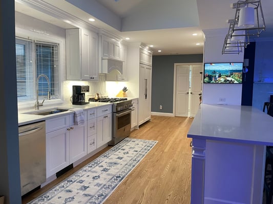 galley kitchen with large window above sink