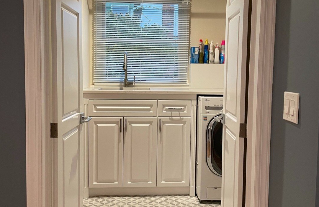 Laundry room in Islip, NY remodel by Kuhn Construction with sink