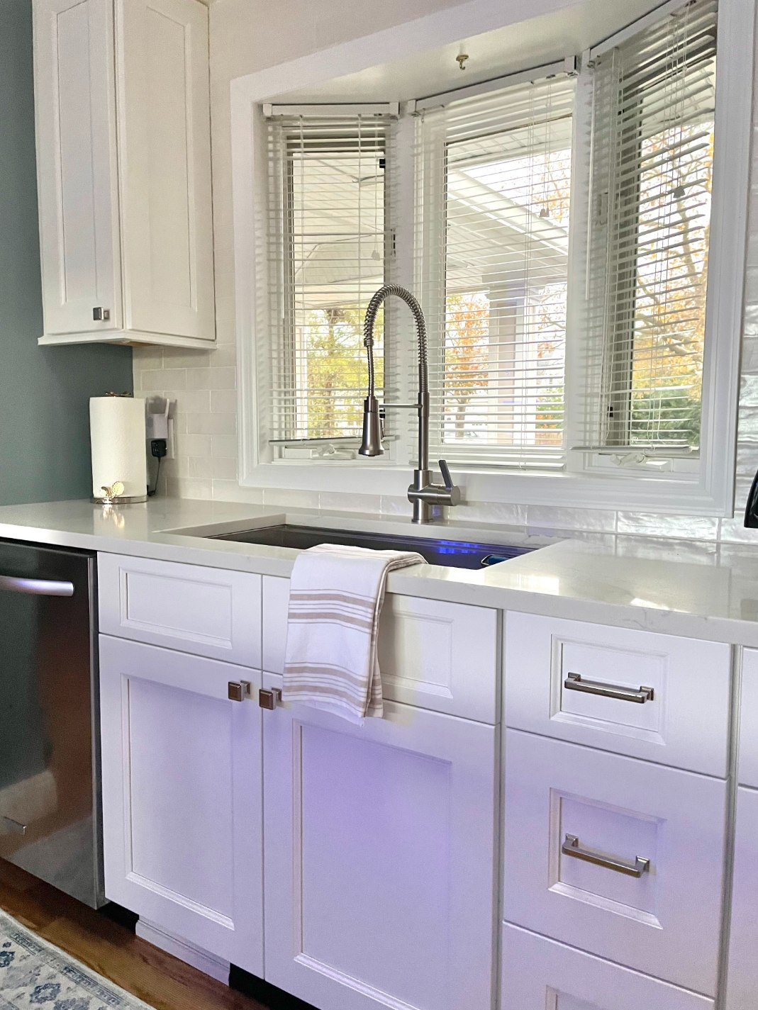 Window behind under mount sink in Islip, NY kitchen remodel by Kuhn Construction