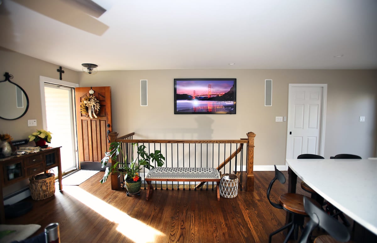 Open entryway with stairs in Islip, NY home remodel by Kuhn Construction