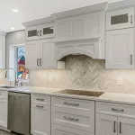 Kitchen remodel by Kuhn Construction with Fabuwood cabinets and mosaic backsplash