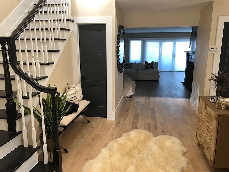 entryway with bench and view into living room