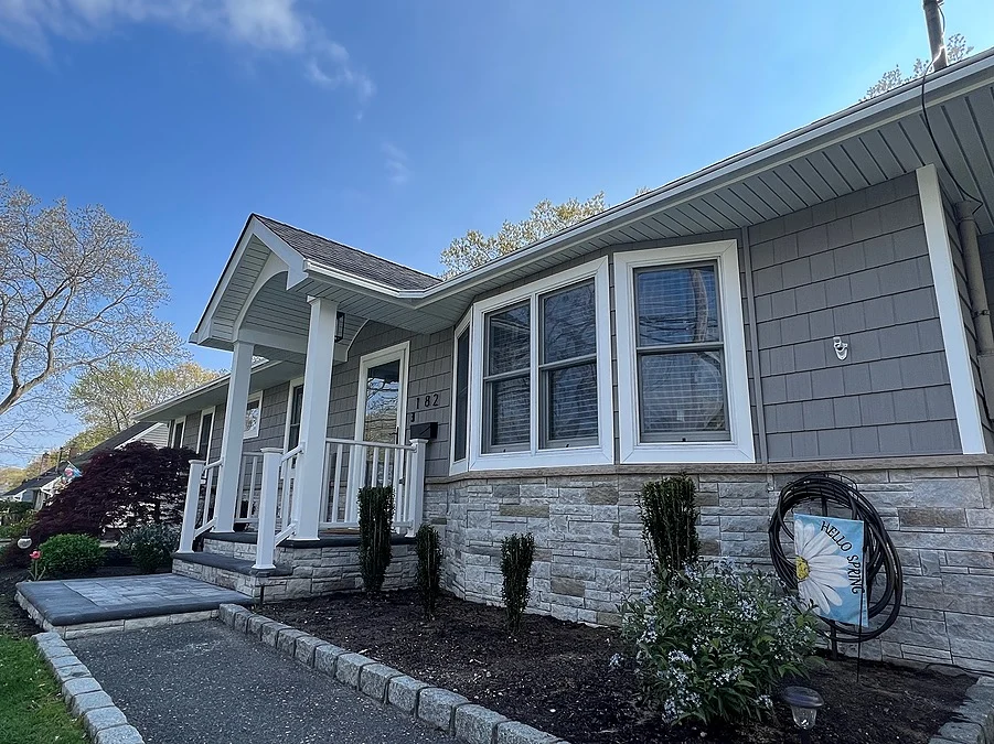 Coastal style exterior remodel on one-story home in Patchogue, NY by Kuhn Construction