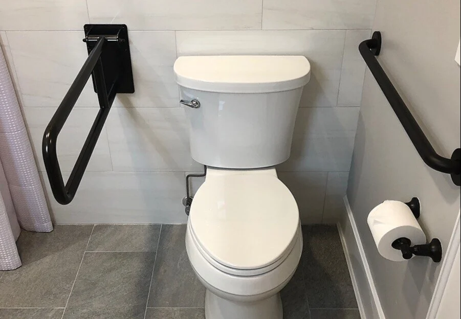 Kohler white toilet in ADA-Compliant bathroom remodel in Long Island by Kuhn Construction