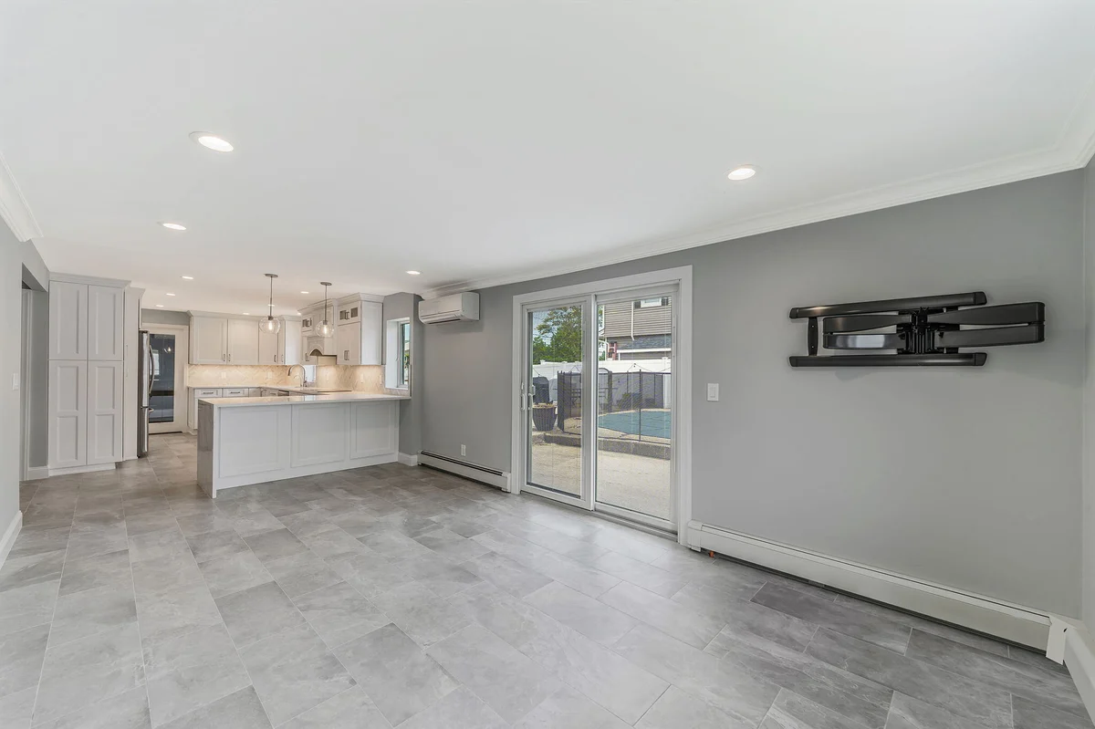 Kuhn Construction kitchen renovation in Islip, New York with an open layout to living area