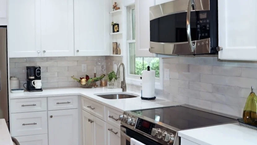 gould white kitchen with stainless appliances