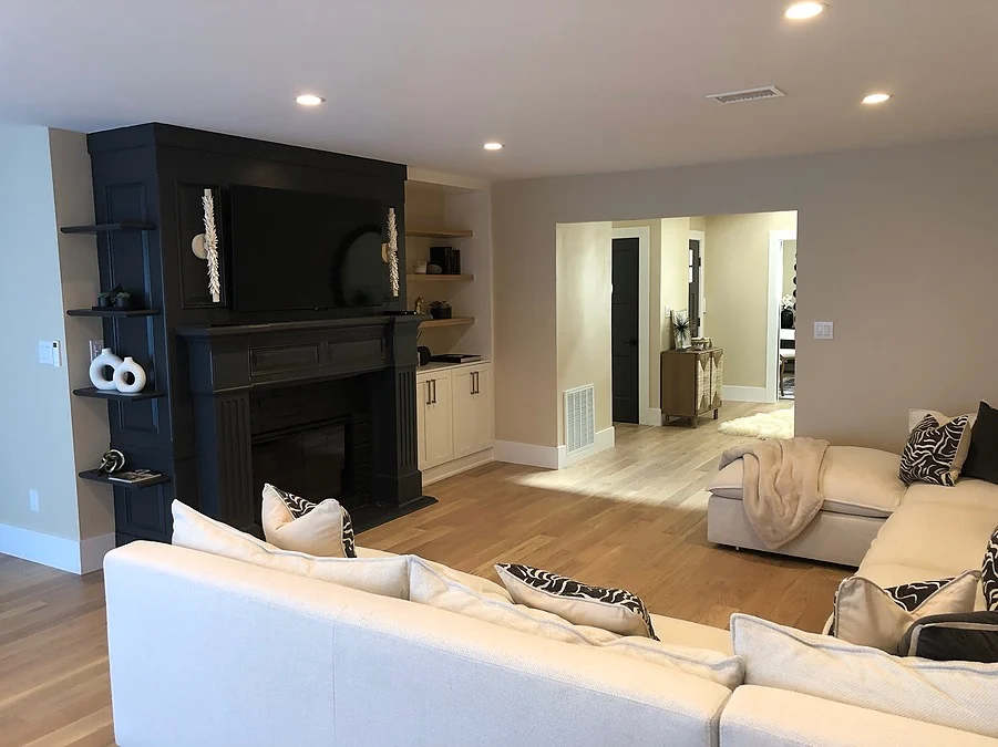 living room with fireplace and built-in shelves